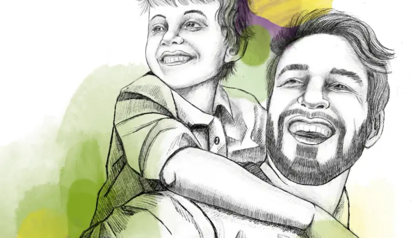 Ein Vater trägt seinen Sohn auf den Schultern. Der Junge lacht und umarmt ihn. Ein fröhlicher Moment, der an einen adhs-test kind 6 jahre erinnert.
